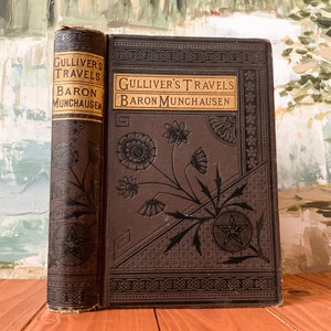 Gulliver&#39;s Travels by Jonathan Swift & Baran Munchausen . Published by Albert Cogswell, Publisher, in 1880. Illustrated
