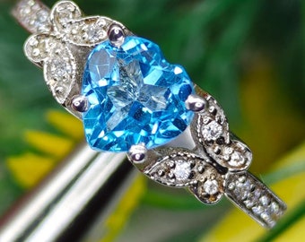 天然スイスブルー トパーズ ハロー リング、10 x 14 mm オーバル