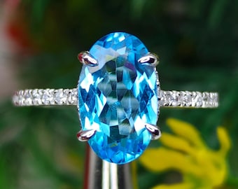 天然スイスブルー トパーズ ハロー リング、10 x 14 mm オーバル