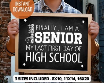 May include: A black chalkboard sign with a wooden frame. The sign reads "FINALLY, I AM A SENIOR, MY LAST FIRST DAY OF HIGH SCHOOL" in white text. The sign also includes the text "Class of 2024" and "3 SIZES INCLUDED - 8X10, 11X14, 16X20".