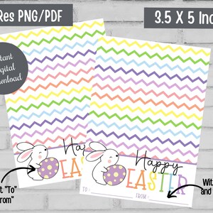 May include: Two printable Easter gift tags with a colorful chevron pattern. One tag has the text "Happy Easter" and the other tag has the text "Happy Easter" with spaces for "To" and "From". Both tags feature a white bunny holding a purple egg with white polka dots.