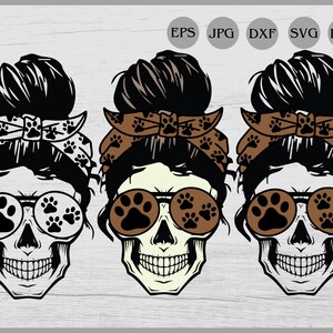 May include: Three black and white skull illustrations with brown paw print sunglasses and brown bandana headbands with paw print designs.