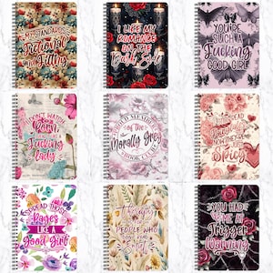 May include: Nine spiral-bound notebooks with various designs and text. The covers feature floral patterns, bats, candles, and phrases like "My Standards Fictional and Filthy" and "You're Such a Fucking Good Girl." The notebooks are designed for writing.