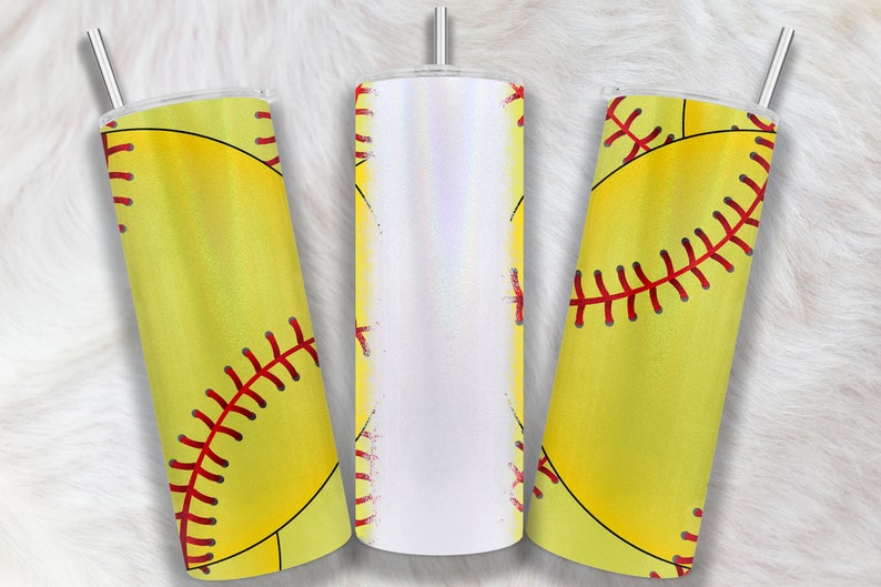 May include: Three stainless steel tumblers with a yellow softball design. The tumblers have a white, iridescent finish and a red stitching design on the softball.