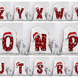 May include: Set of 12 white Christmas gift bags with red and black buffalo plaid letters and Santa hats. The letters spell out the alphabet from Q to Z.