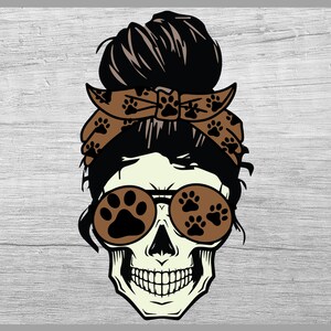 May include: A white skull with a black bun hairstyle, wearing brown sunglasses with paw print designs and a brown bandana with paw print designs.