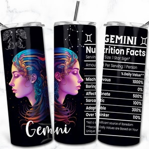May include: A black Gemini-themed tumbler with a straw. The design features a woman's profile with colorful hair and the word "Gemini". The tumbler also includes a "Nutrition Facts" label with zodiac-related traits.