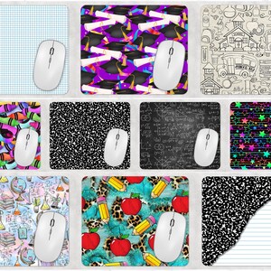 May include: A collection of mouse pads with various designs, including a blue grid, graduation caps and diplomas, school-themed doodles, colorful crayons, composition book paper, mathematical equations, and stars. Each pad has a white wireless mouse.