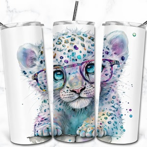 May include: A white stainless steel tumbler featuring a colourful illustration of a snow leopard wearing glasses. The leopard has blue eyes and is surrounded by colourful paint splatters.