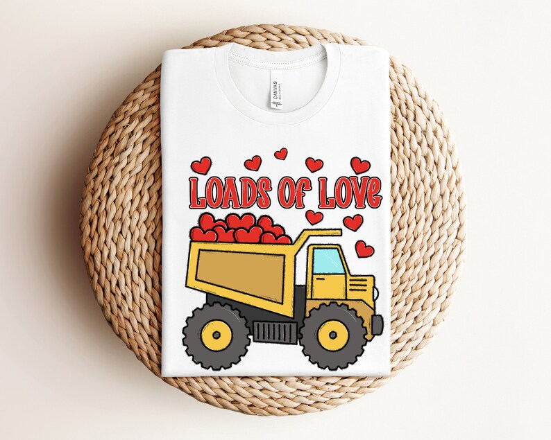 May include: White t-shirt with a yellow dump truck filled with red hearts and the text "Loads of Love".