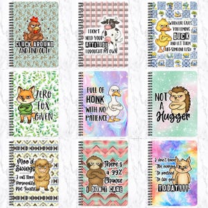 May include: A selection of spiral-bound notebooks, each with a different animal illustration and a humorous phrase. The notebooks feature a chicken, cow, duck, fox, hedgehog, sloth, and a wolf. The covers have unique patterns and a variety of colours.