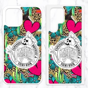 May include: A white phone case with a colorful design featuring a skeleton with the text "Expensive, Difficult & Talks Back". The design includes cacti, hearts, leopard print, and turquoise accents.