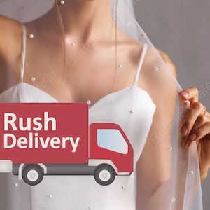 May include: A white bridal veil with pearl embellishments and a red truck graphic that says "Rush Delivery".