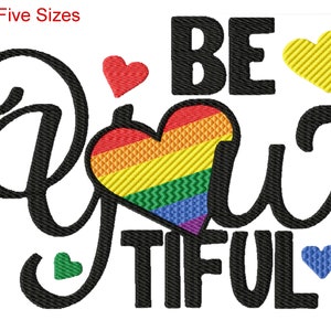 May include: Black and white embroidery design with the text "Be You Tiful" and a rainbow heart. The design includes several small hearts in red, yellow, green, and blue.