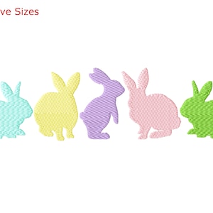 May include: Five colorful bunny silhouettes in a row. The bunnies are in shades of blue, yellow, purple, pink, and green.