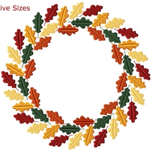 May include: A wreath made of autumn leaves in shades of red, orange, yellow, and green. The leaves are arranged in a circle, creating a festive and seasonal design.