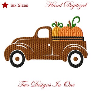 May include: An embroidery design featuring a brown truck carrying two orange pumpkins with green stems. The text "Six Sizes" appears in the top left, "Hand Digitized" in the top right, and "Two Designs In One" at the bottom in red.