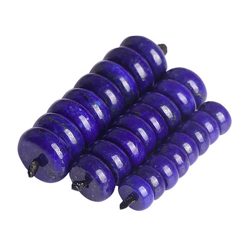 May include: A stack of dark blue lapis lazuli beads, each bead is round and has a hole in the center.