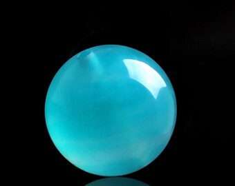 May include: A smooth, round, turquoise blue gemstone bead with a small hole drilled through the top.