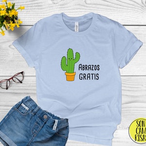 Abrazos Gratis Cute Spanish Shirt , Camiseta Espanol , Play on Words Cartoon in Spanish , Funny Puns Unisex T Shirt