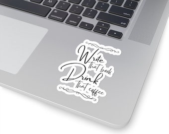 May include: A white laptop sticker with black text that reads "Write that book Drink that coffee".