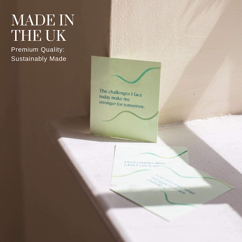 May include: Two green and white cards with inspirational quotes. The top card reads "The challenges I face today make me stronger for tomorrow." The bottom card reads "I feel curious about what I can learn."