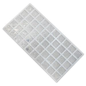 May include: A white plastic grid with small squares, filled with white glitter. The grid is designed for organizing and storing small items.