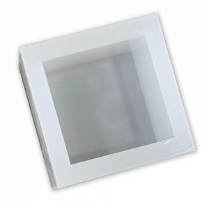 May include: White silicone mold for making square soap bars. The mold has a smooth, glossy finish and is designed to create a professional-looking soap.