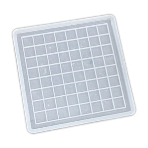 May include: A transparent, square resin mould featuring a grid pattern. The mould has a raised edge and is designed for crafting small, square items. The grid consists of evenly spaced lines, forming a checkerboard-like design.
