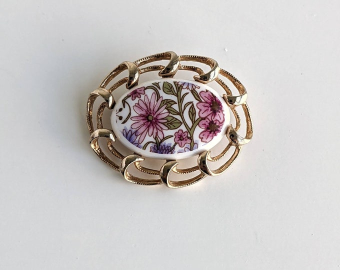 Vintage Sarah Coventry gold tone brooch with white pink and floral ceramic centre
