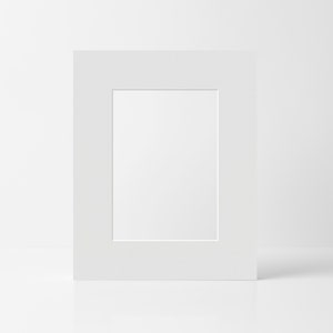 May include: A white mat with a rectangular opening in the center. The mat is on a white surface.