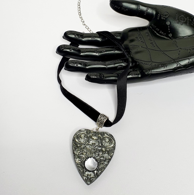 Goth and Occult. on a black velvet choker handmade resin Black planchette choker silver and black floral Ouija planchette