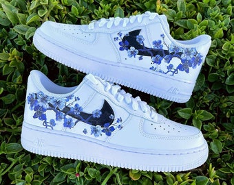 black nike shoes with flowers