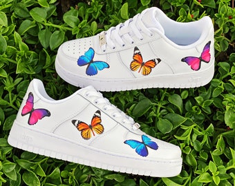 white nike shoes with butterflies
