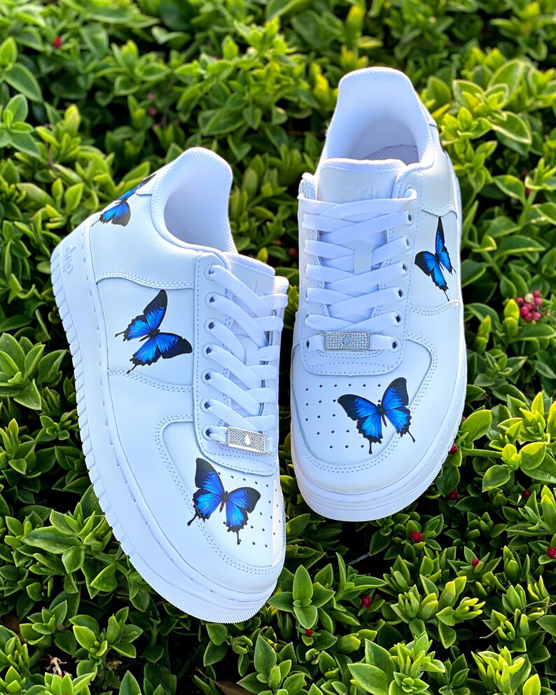 white shoes with blue butterflies