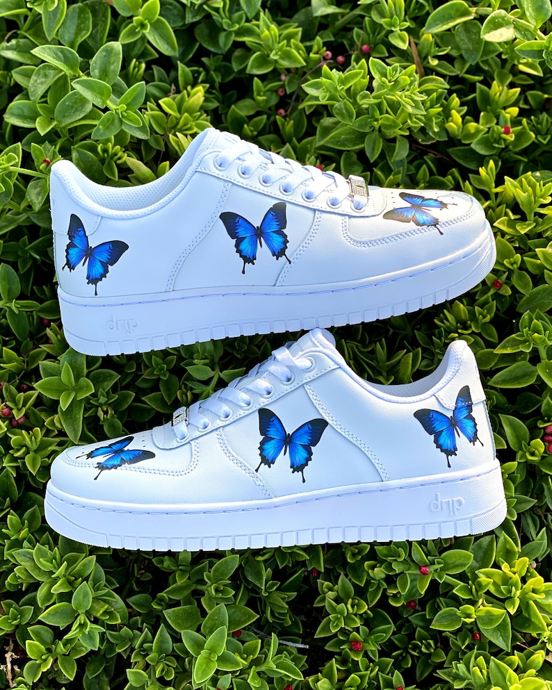 white shoes with blue butterflies