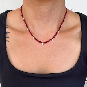 Deep red crystal necklace with gold teardrop accents