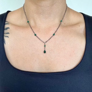 Emerald green crystal pendant necklace with matching crystal accents
