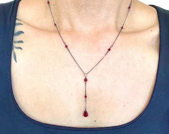 Red crystal drop necklace on delicate gunmetal grey or gold chain