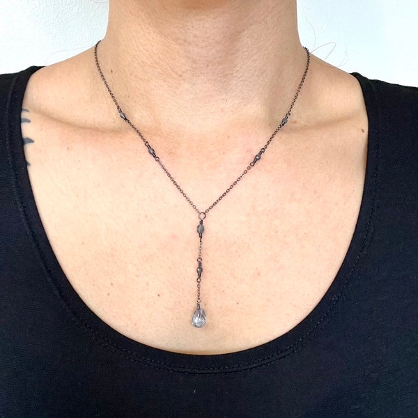 Pale blue crystal drop necklace on delicate gunmetal grey chain