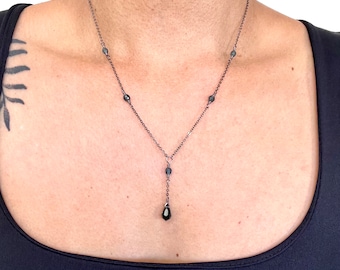 Dusky blue crystal drop necklace on delicate gunmetal grey chain, two versions