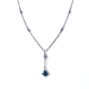 Hanging blue lily drop necklace on delicate gunmetal grey chain