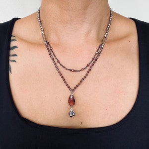 Unique burgundy crystal pendant necklace with double strand beads and pearl accents