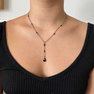 Black onyx long drop necklace on delicate gunmetal grey or gold chain. 18-19” adjustable with extender