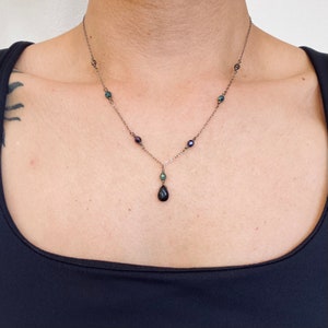Black onyx pendant necklace with metallic bead accents