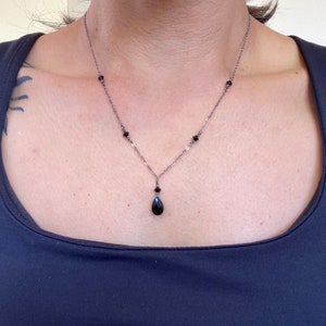 Onyx pendant necklace with black crystal accents on delicate gunmetal silver chain