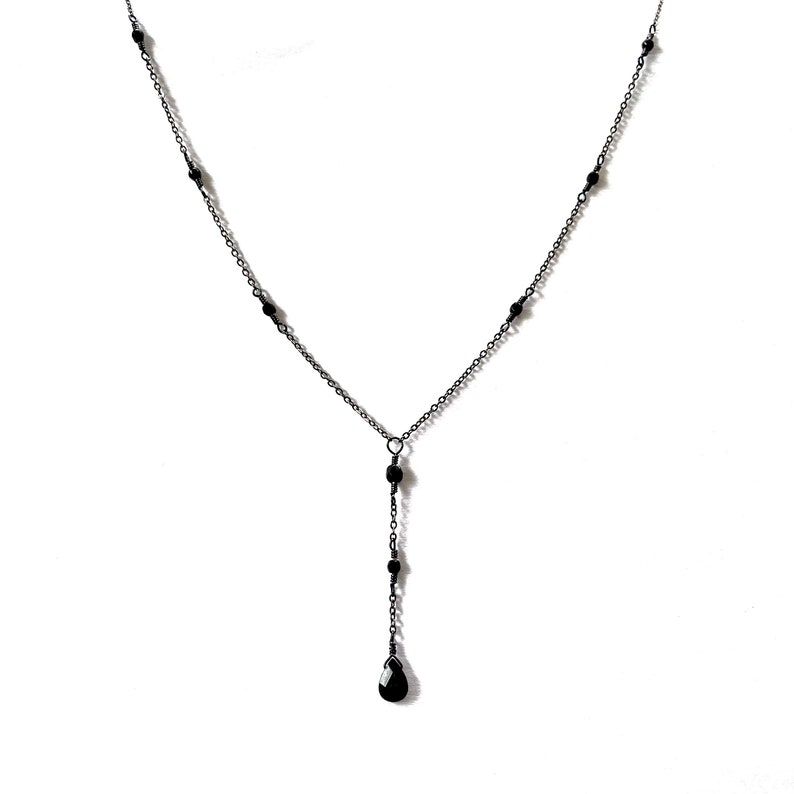 Black onyx long drop necklace on delicate gunmetal grey or gold chain. 18-19” adjustable with extender
