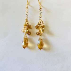 Delicate champagne teardrop crystal earrings with tiny cascading crystals and pearls