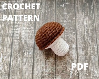 Op de afbeelding: Haakpatroon PDF voor een bruine en witte paddenstoel amigurumi. De paddenstoel is gehaakt met bruin garen voor de dop en wit garen voor de steel.