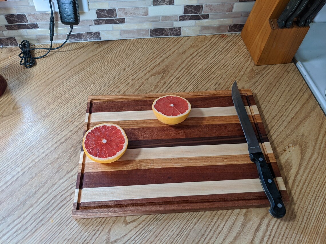 Handcrafted solid wood cutting board with juice tray Etsy